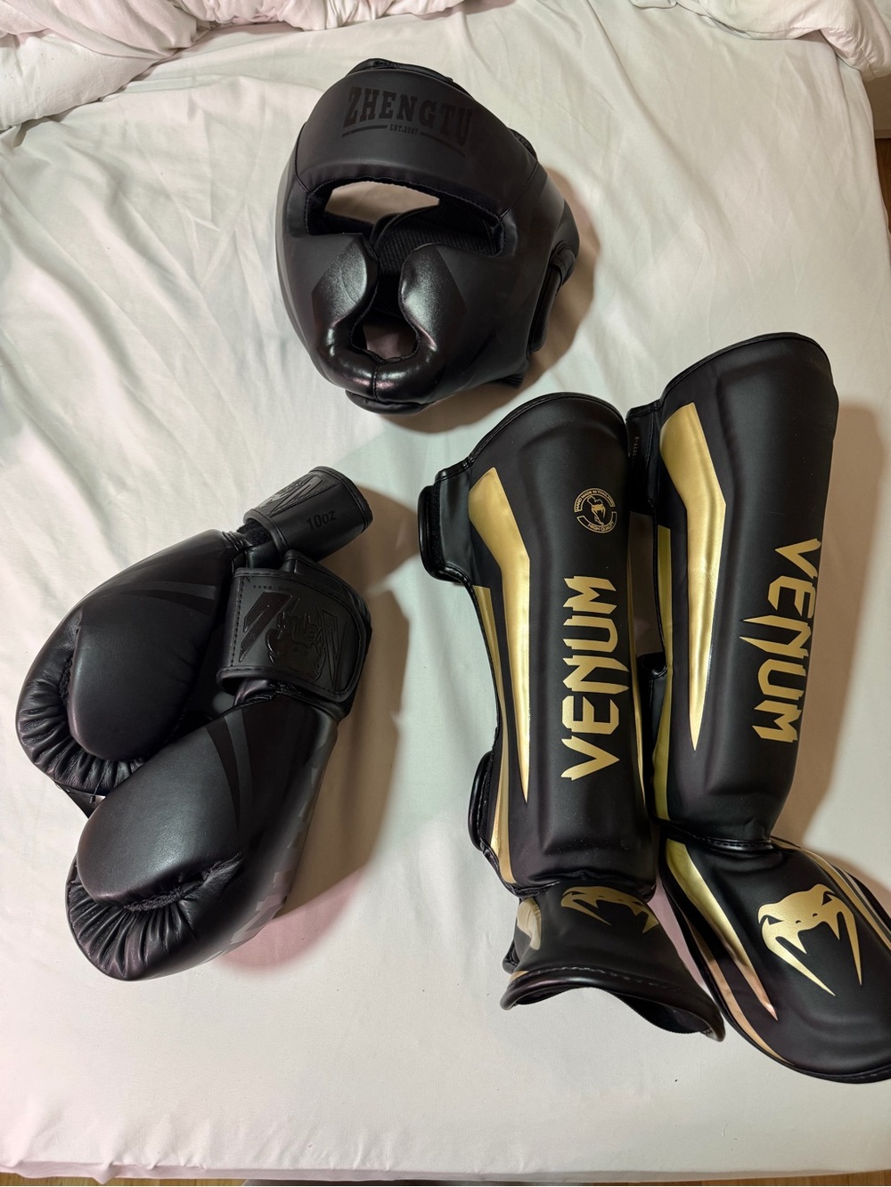 Venum Black & Gold Shin Guards with Matching Black Headgear and Gloves